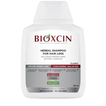 شامپو گیاهی ضد ریزش موهای معمولی تا خشک بیوکسین مدل HERBAL